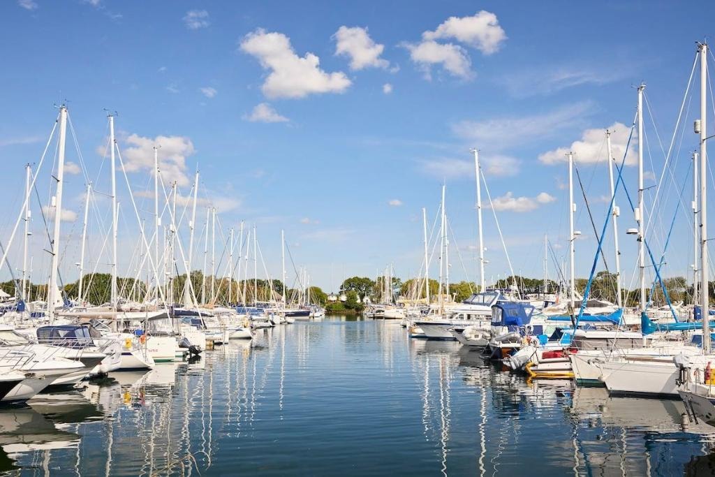 Marina with sailboats on calm South Coast water